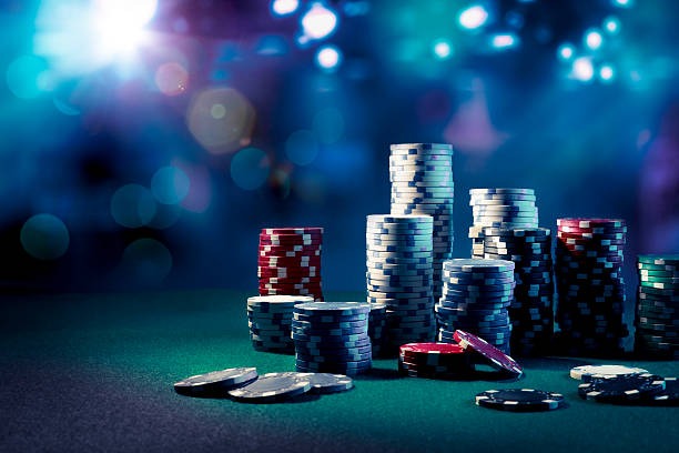 Live dealer at Andar Bahar table with card deck and chip tray